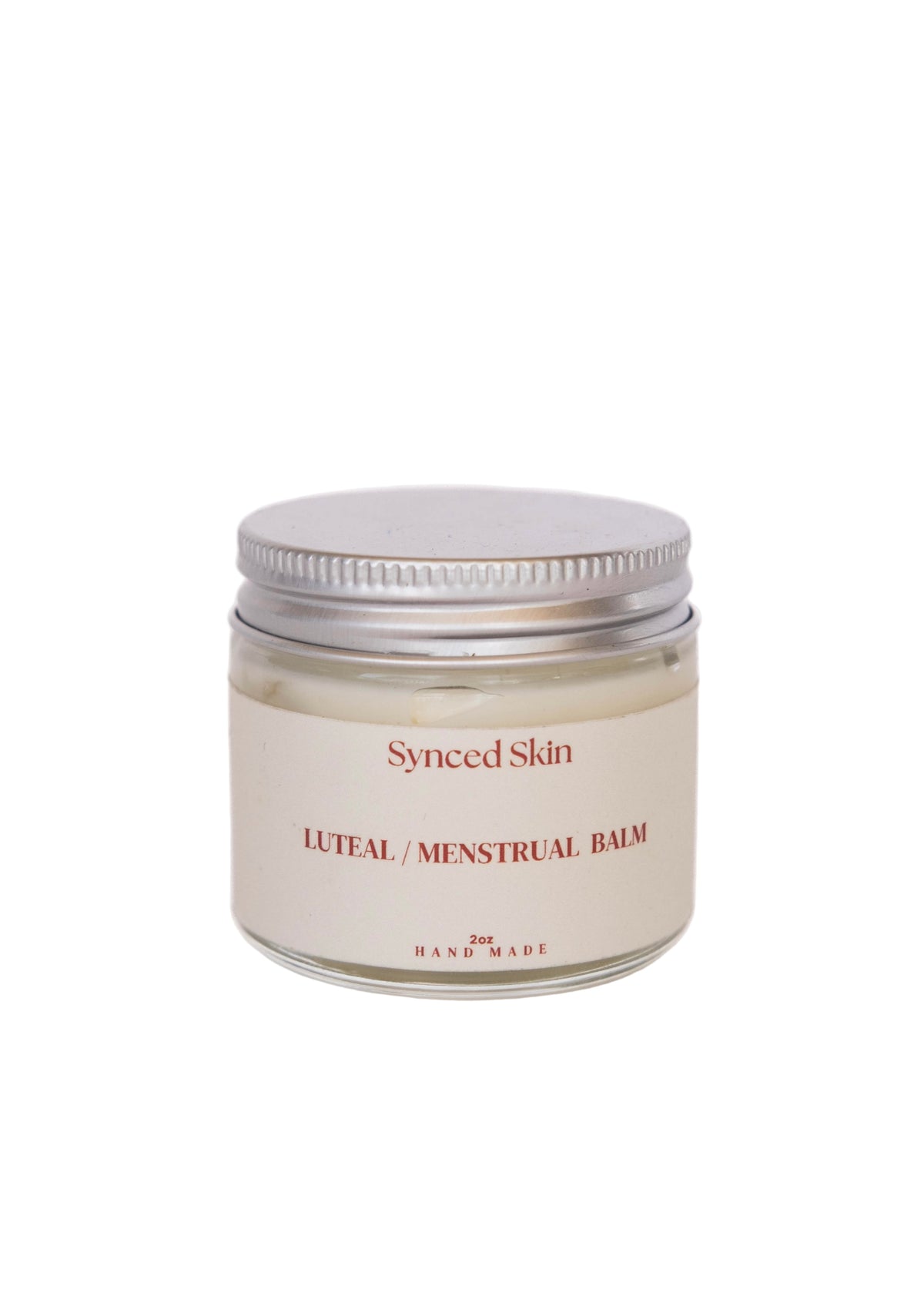 Synced Skin Luteal / Menstrual Balm in a closed 2 oz glass jar with a silver lid and cream label.