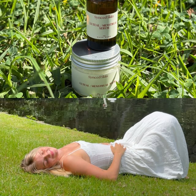 Synced Skin products in grass with a woman resting outdoors