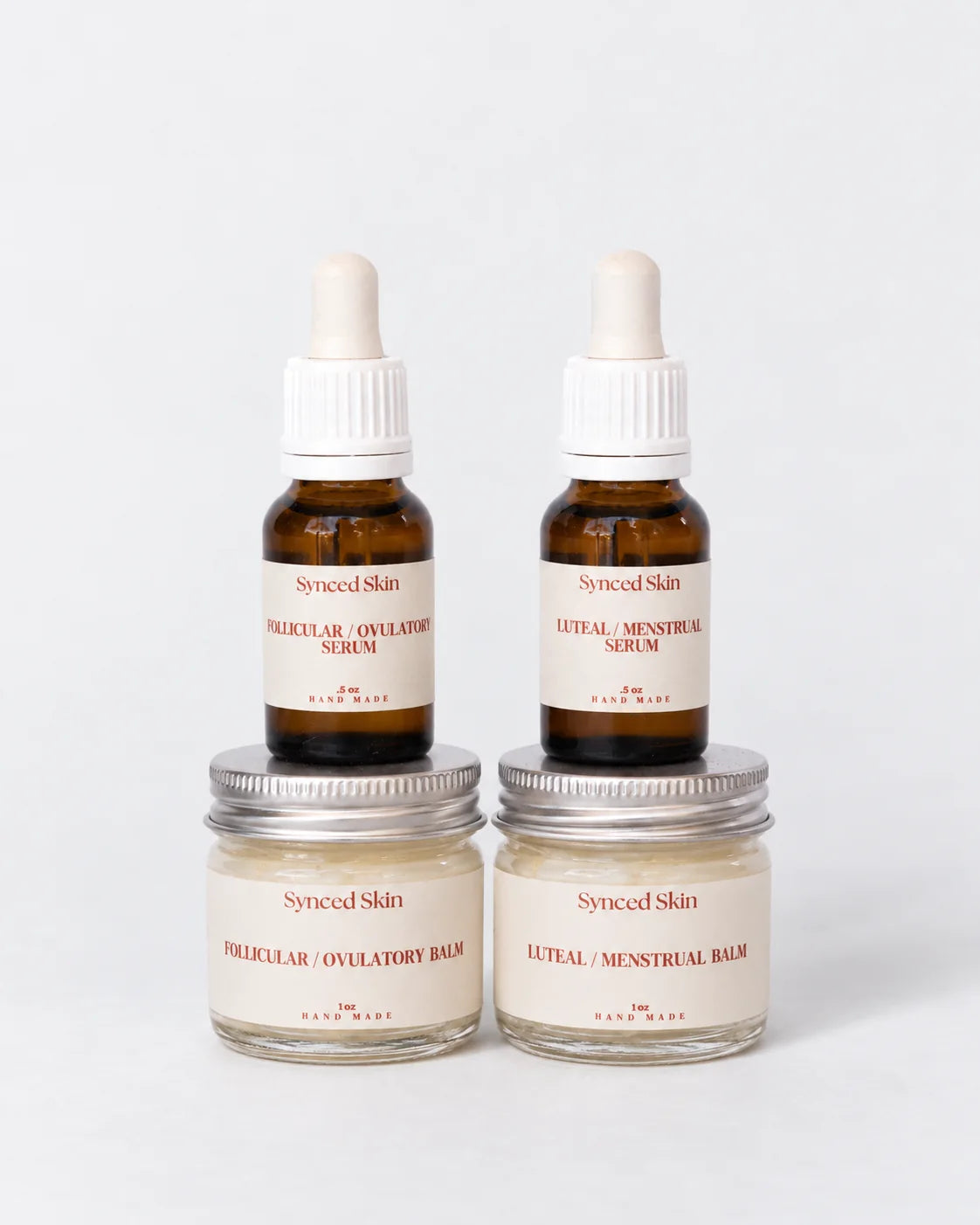 Mini Synced Skin Starter Kit — studio illustration of two 0.5 oz serums and two 1 oz balms